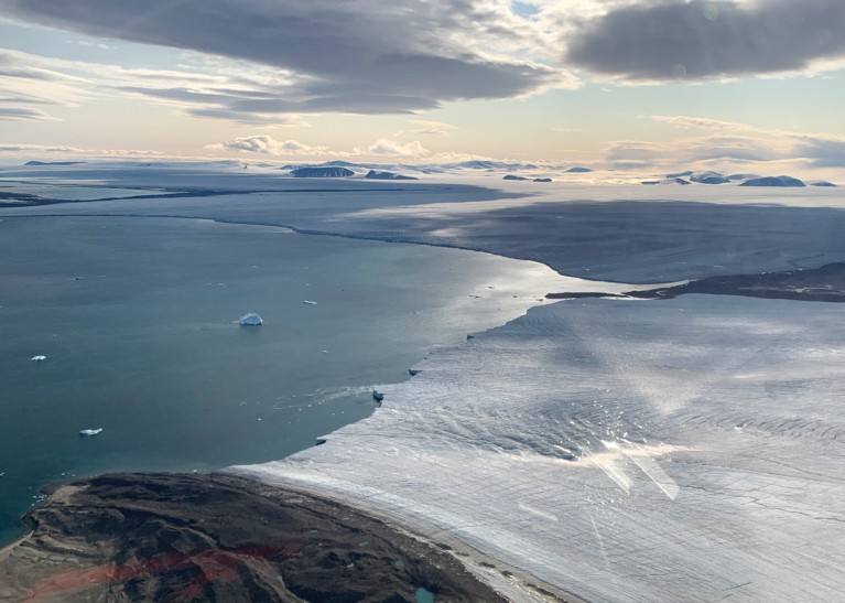 Aerial view of outlets of the ice cap covering eastern Devon Island, Canada meeting the ocean.