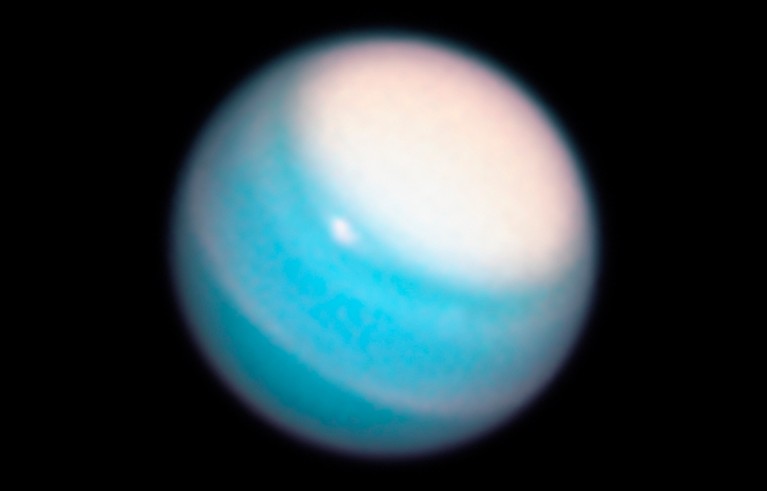 Hubble Space Telescope image of Uranus, showing a vast bright stormy cloud cap across the planet’s north pole.
