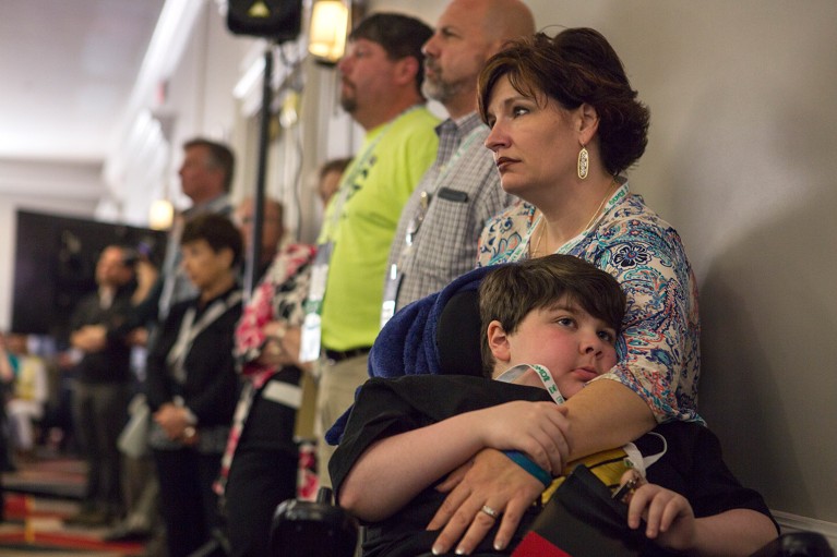 Stacie Al-Chokhachi and her son who suffers from DMD, at a FDA meeting about a new drug treatment for the disease.