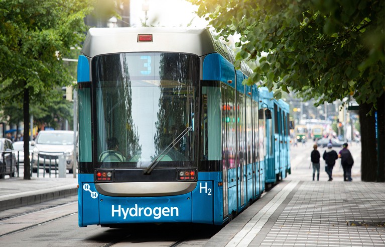 A hydrogen fuel cell tram on a city street.