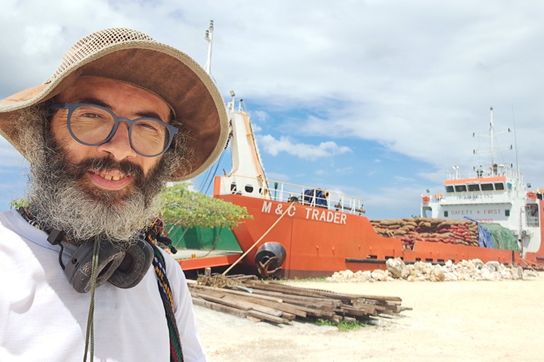 Dr Grimalda takes a selfie with a cargo ship in the background