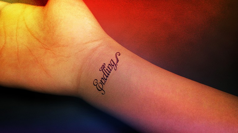A human wrist with the word endlings tattooed across it in cursive script