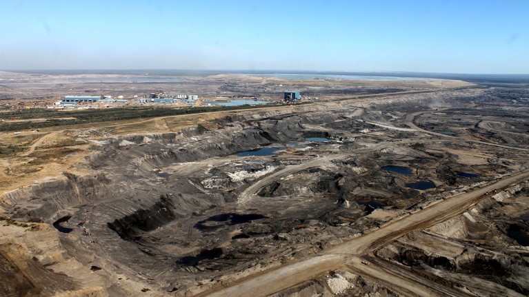 An aerial photo of the Athabasca oil sands operations, with tar and dirt exposed.