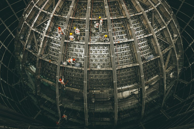 Workers at the construction site of China's next-generation neutrino detector, Jiangmen Underground Neutrino Observatory.