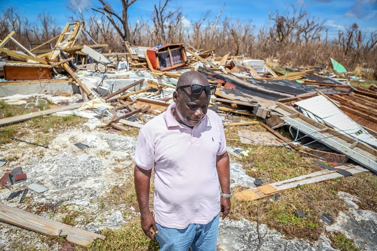 A person stands among the rubble of his hurricane-destroyed home in High Rock, Grand Bahama, Bahamas, September 2019.