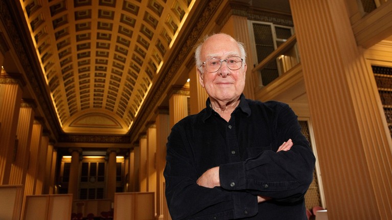 Professor Peter Higgs poses for a portrait at an Edinburgh University press conference in 2012.