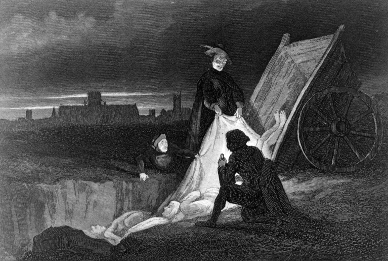 Photo of a black and white engraving showing several people lowering plague victims' bodies into a pit from a cart, with a village skyline in the background