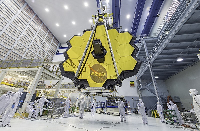 NASA technicians lift the telescope into a clean room using a crane in April 2017.