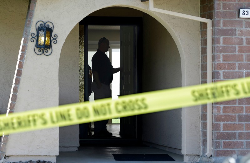 Authorities search the home of a suspected killer