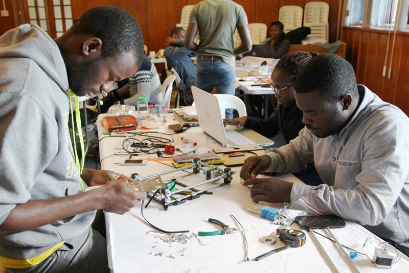 Participants learn how to build lab equipment at a workshop