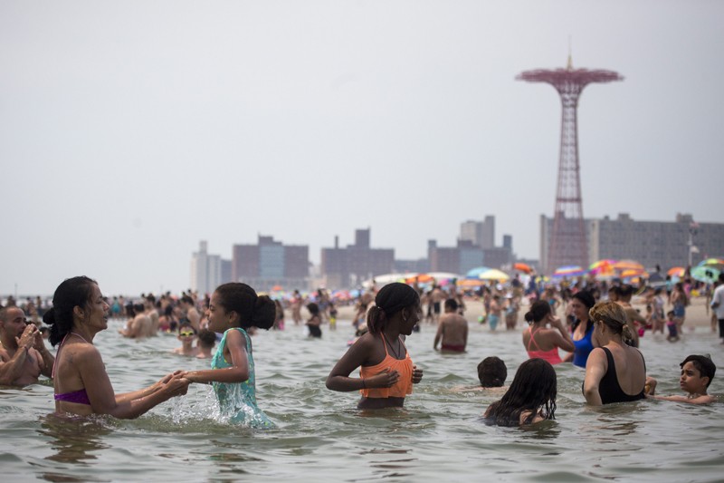 Crowds take to the water on a hot afternoon at Coney Island in New York, July 1, 2018.