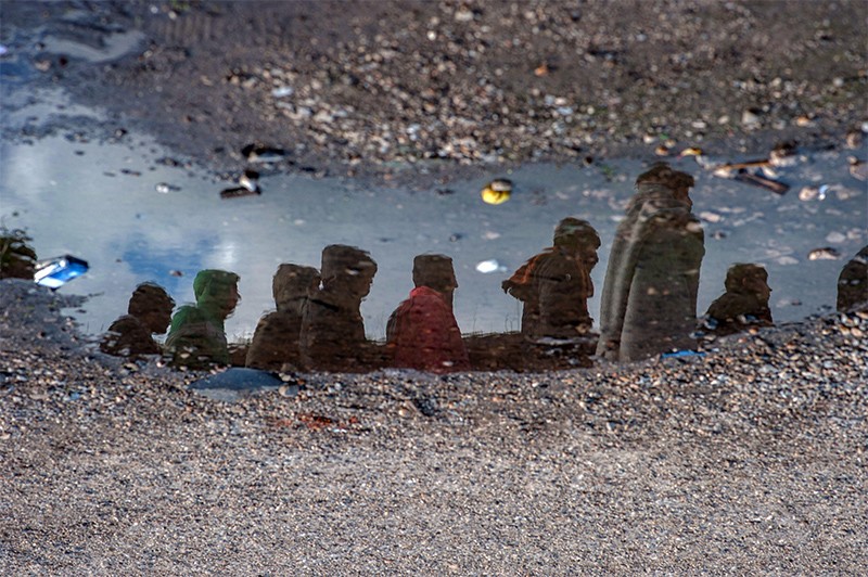 Reflection of migrants near the main train station in Belgrade, Serbia.