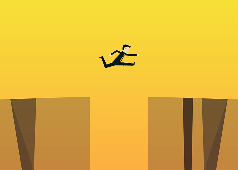 Person jumping over a pitfall