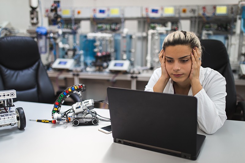 An overworked worker in a lab