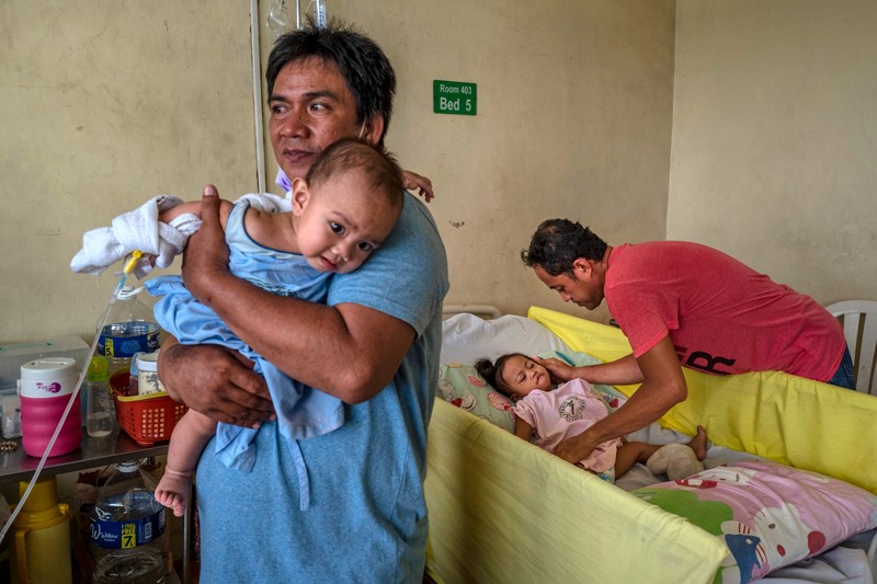 Filipino children suffering from measles are treated at a government-run hospital in Manila, Philippines